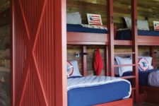 12 a rustic blue and red boys’ bedroom and a matching red barn door to highlight the theme