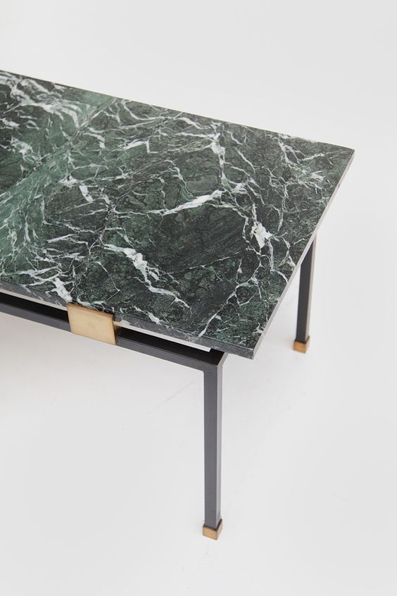 A stylish statement cna be easily made   just buy a coffee table with a green marble top