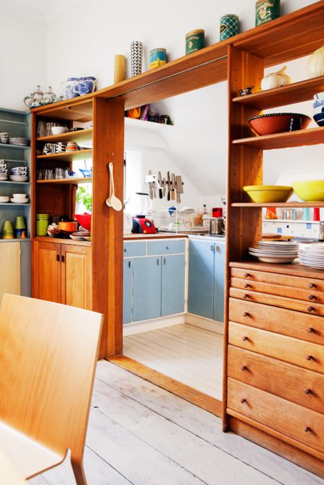 pass-through shelves to separate a kitchen and a dining zone and keep the space open enough yet separated