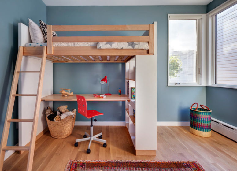 The kids' room is done in a creative way with a wooden bed up placed on shelving units and with a desk down