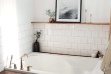 13 a cozy bathroom niche done with white tiles and a bathtub clad with stained wood