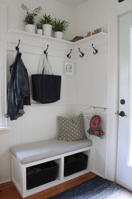 a small bench with drawers inside is ideal for a tiny entryway to rock
