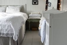 15 a peaceful shabby chic bedroom decorated in neutrals and a baby’s crib by the wall