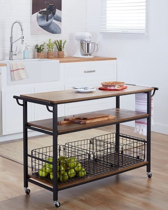 a portable kitchen island of blackened metal, casters and some wooden tops plus two shelves for comfy storage