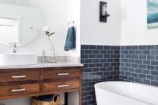 16 a contemporary bathroom with a navy tile backsplash with white grout for a chic touch
