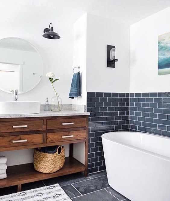a contemporary bathroom with a navy tile backsplash with white grout for a chic touch