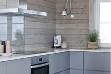 16 a minimalist chalet kitchen with sleek grey cabinets and wooden plank walls plus a glass screen