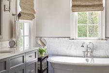 17 a simple marble tile backsplash adds chic to a modern farmhouse bathroom