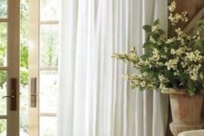 18 An ethereal tab-top white curtain is an ideal piece for a French countryside space