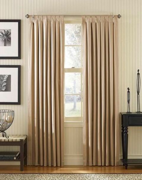 Tab top curtains can also look more dressed up if you choose proper fabric or decorative loops and rods