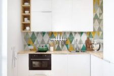 20 a colorful tile backsplash and a bold printed rug make the kitchen more eye-catchy and welcoming