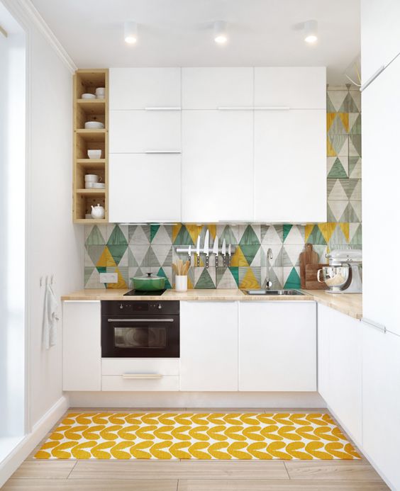 a colorful tile backsplash and a bold printed rug make the kitchen more eye-catchy and welcoming