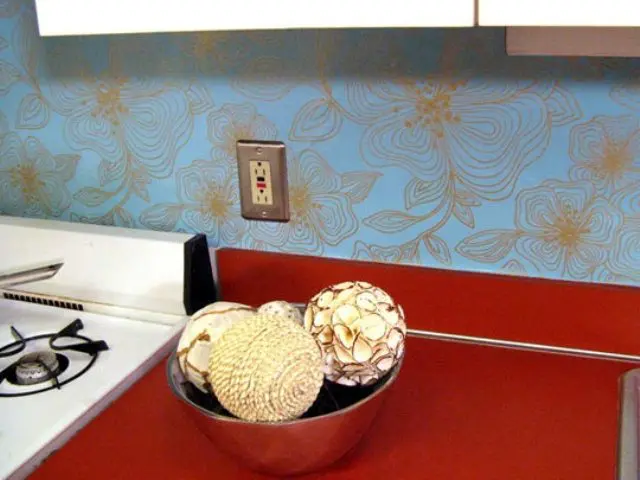 go for contrasting looks and shades using the bold wallpaper and cabinets