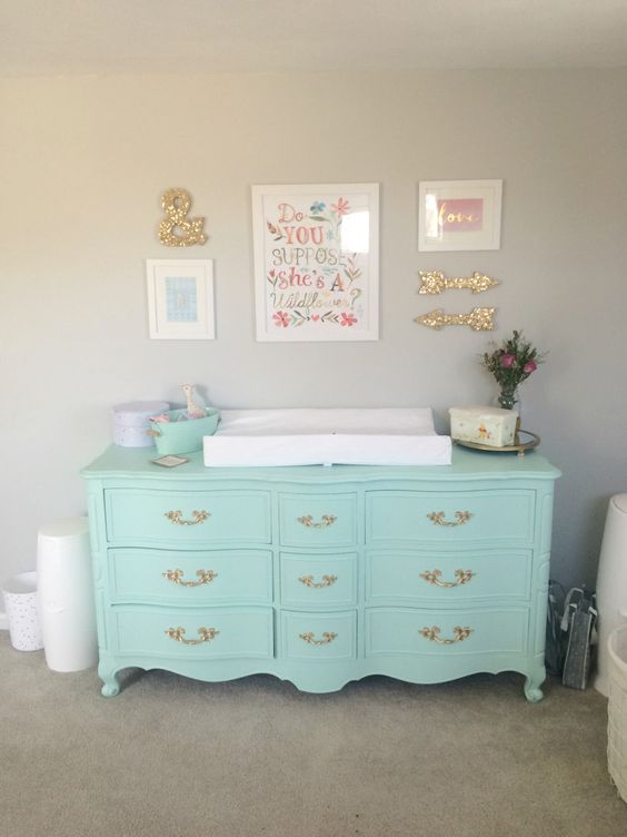 A mint colored dresser can double as a changing table, which is a smart idea