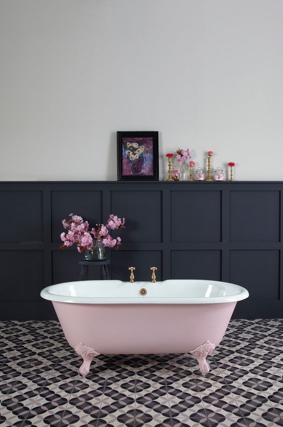 a chic black and pink space with flowers and an artwork for a girl