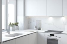 23 a pure white minimalist kitchen is made more catchy with marble surfaces