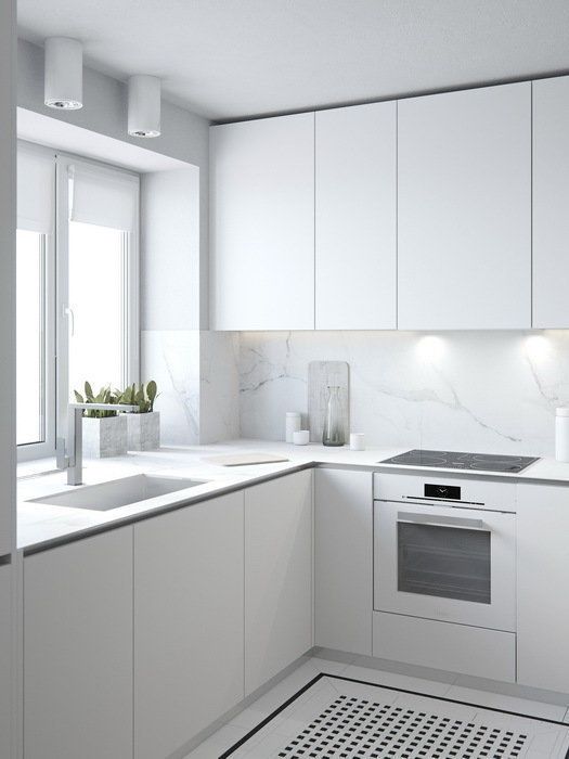 a pure white minimalist kitchen is made more catchy with marble surfaces