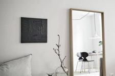 24 a simple vertical mirror in a wooden frame is always a good idea and it will fulfill many functions