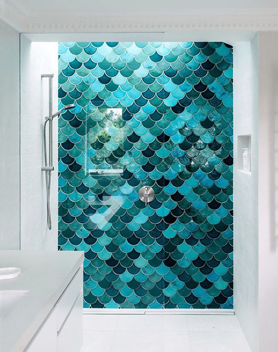 a super bold shower wall with fish scale tiles is a gorgeous way to add color to the bathroom