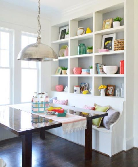 use a blank wall for a large storage unit with a built-in bench, it's a great solution
