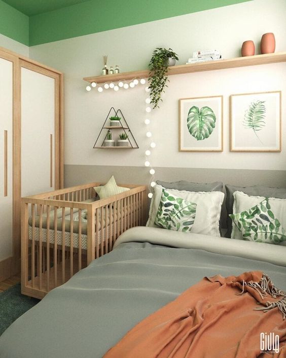 a boho bedroom with a bed and printed bedding, a gallery wall, a shelf with decor, a crib, a wardrobe