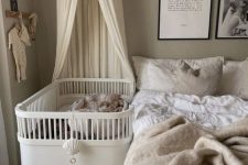 a lovely neutral bedroom with a crib