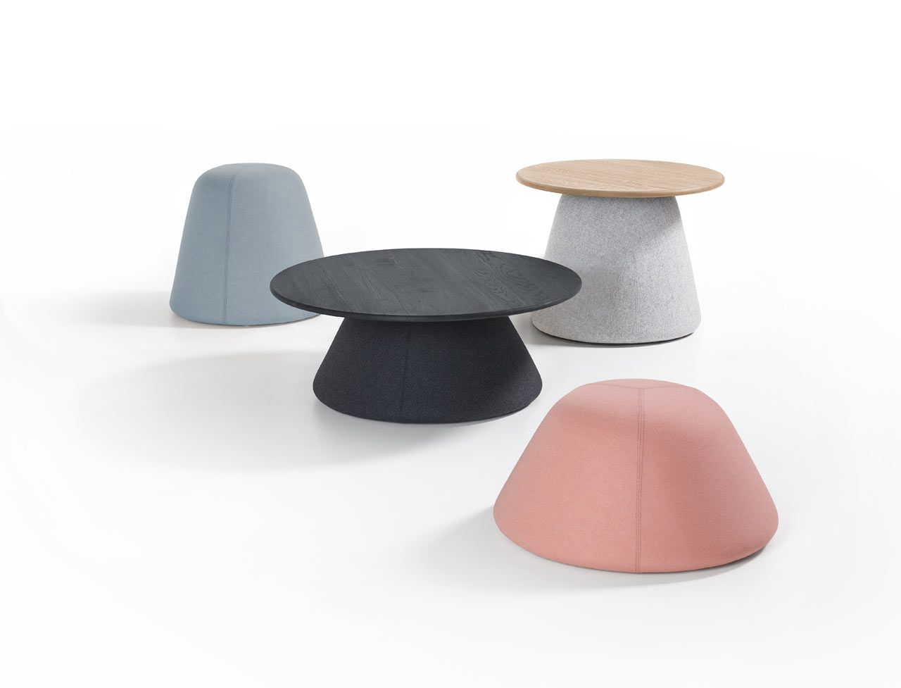 These cute and soft upholstered pieces, which are poufs and tables, were inspired by Dutch mounds