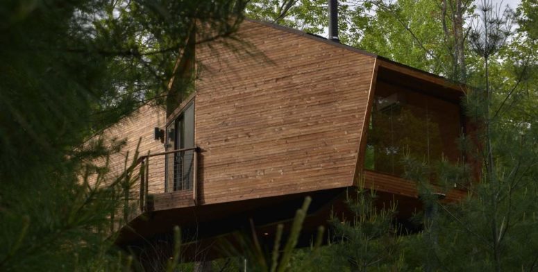 This gorgeous contemporary house is inspired by treehouses, of which many kids dream and here's the dream come true