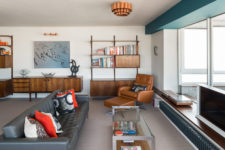 01 This gorgeous mid-century modern apartment features ocean views and effective color blocking