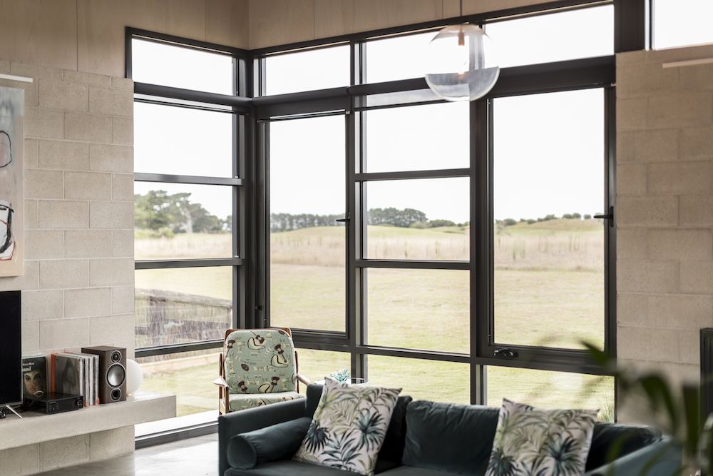 Inside the house, large windows give the living room views towards the sand dunes