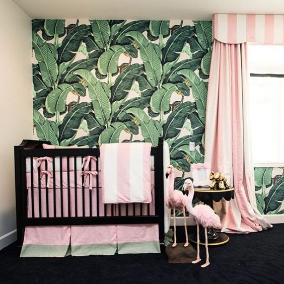 a glam tropical nursery for a girl, a tropical leaf wall, pink striped textiles, flamingos and gilded touches