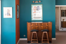 03 Teal and orange walls are used for color blocking and they remind of the ocean spaces around