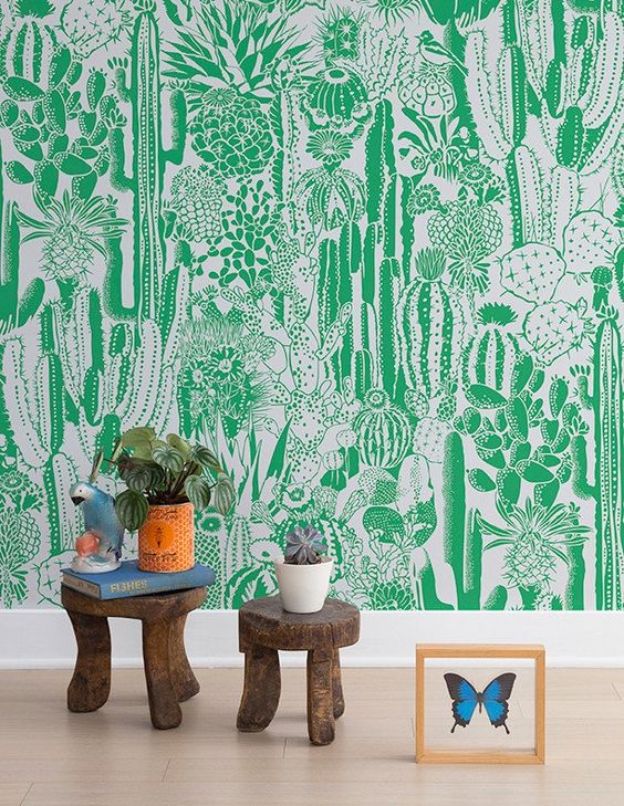 a super bold statement wall done with green and white cactus wallpaper