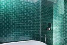 04 a modern bathroom with turquoise tiles and white grout for a bold space with a splash of color