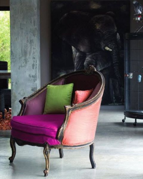 A vintage styled chair with neon upholstery in fuchsia, peachy pink and purple to create a contrasting look