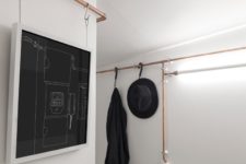 05 Copper pipes serve as an open closet and even hold outlets and I think that they give the apartment its own character