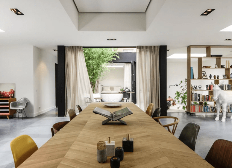 The patio with curtains fills the house with light and air and refreshes the space