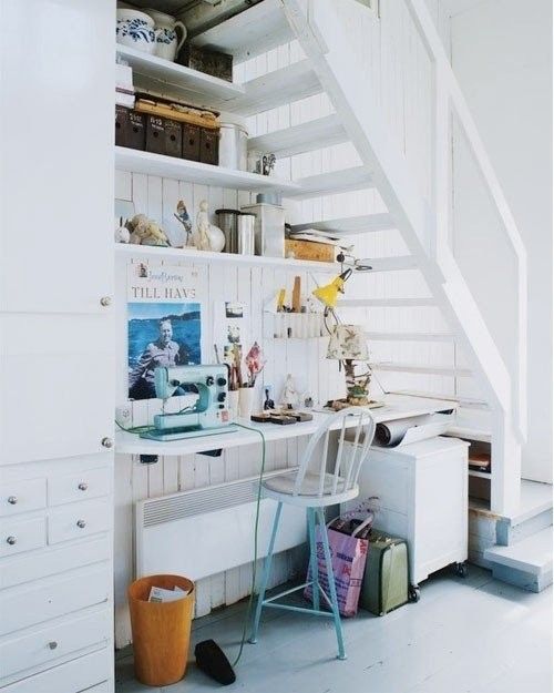 a home office gets much light thanks to the staircase with only steps and no risers