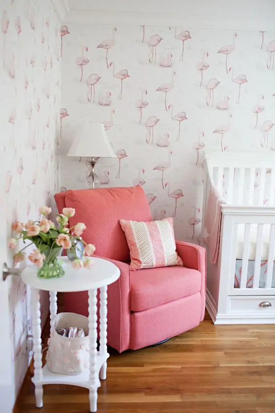 add a tropical feel to the nursery with pink flamingo wallpaper walls and pink touches