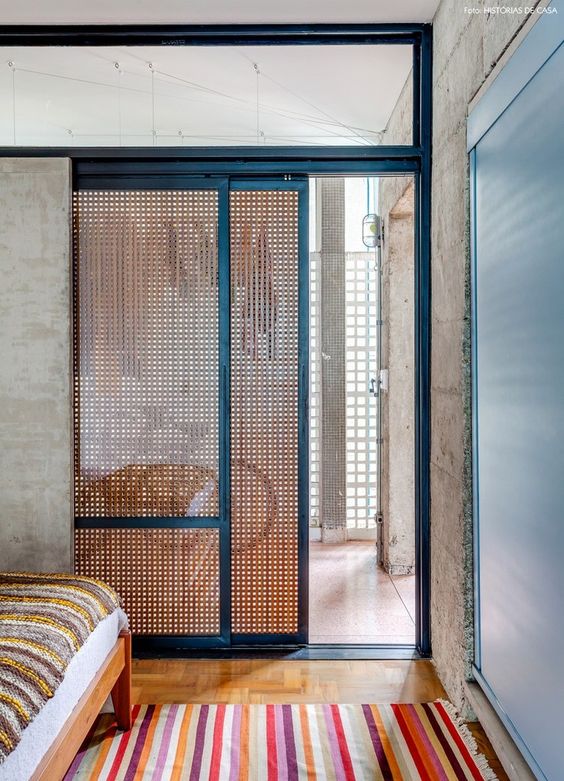 use wood lattic and glass for sliding doors to let some light in and prevent the space from cold coming from the entryway