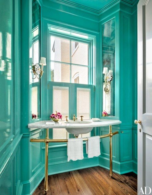 a bold turquoise powder room with brass fixtures and elegant touches is a unique idea to rock in your home