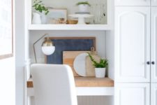 06 build in a small office nook in your kitchen with shelves and a desk covered with a wooden countertop and a comfy chair