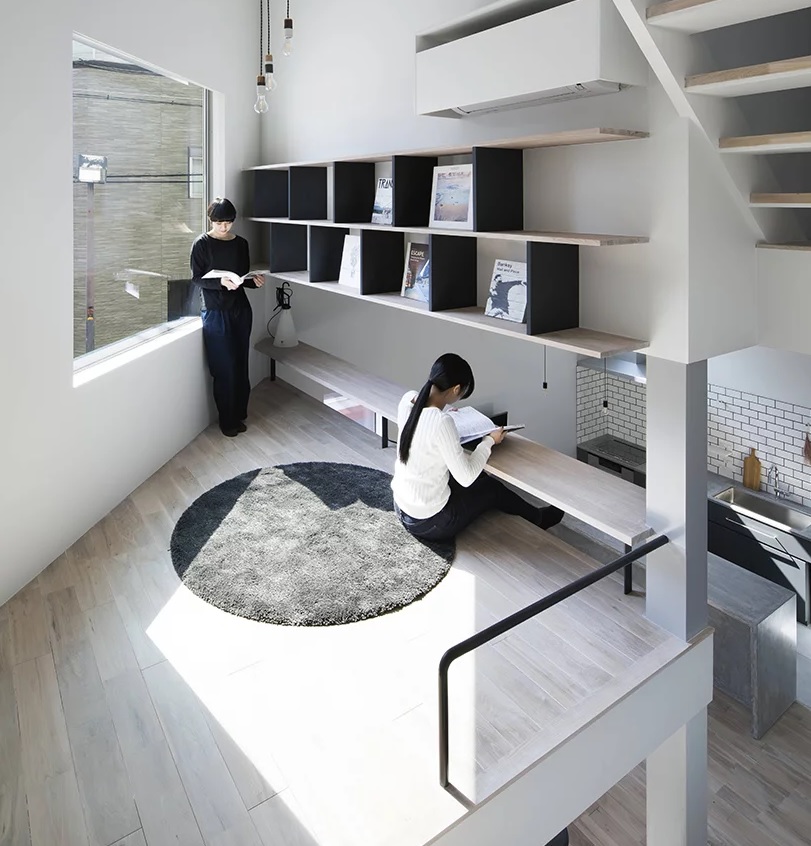 The sub level over the kitchen features a study or workspace with a creative desk built in above the floor