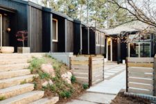 08 The exterior of the house is clad with black painted wood