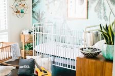 08 a tropical nursery for a boy, a blue palm print wall, printed rugs and warm-colored wooden furniture