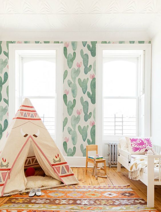 watercolor is very trendy, and watercolor cactus print wallpaper is a dreamy option for a kid's room