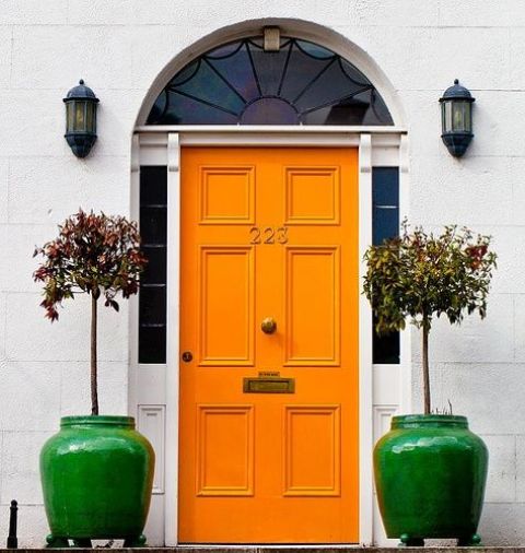 paint the door orange and add a couple of bright green pots to personalize the entrance