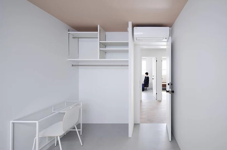 Here's one more working space done in all-white, with white furniture and an open storage unit