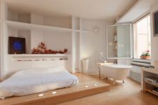 10 an airy Japandi bedroom with a free-standing bathtub by the window to enjoy the views