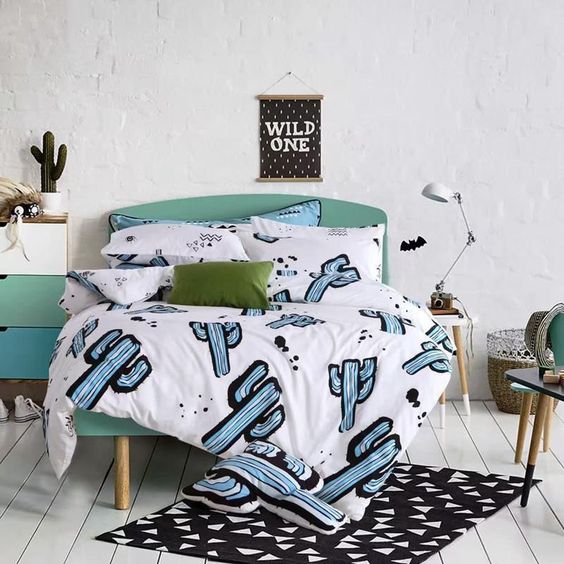 fun blue cactus print bedding for a modern space, would also be fine for a teenage bedroom